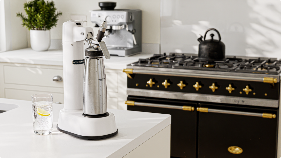Modern kitchen with a CarboPress carbonator and stove in the background